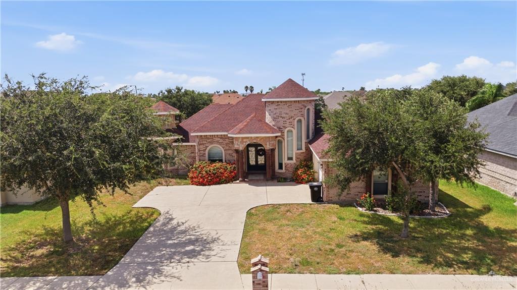 Single Family home at 514 Los Palomos Street, Weslaco, Texas